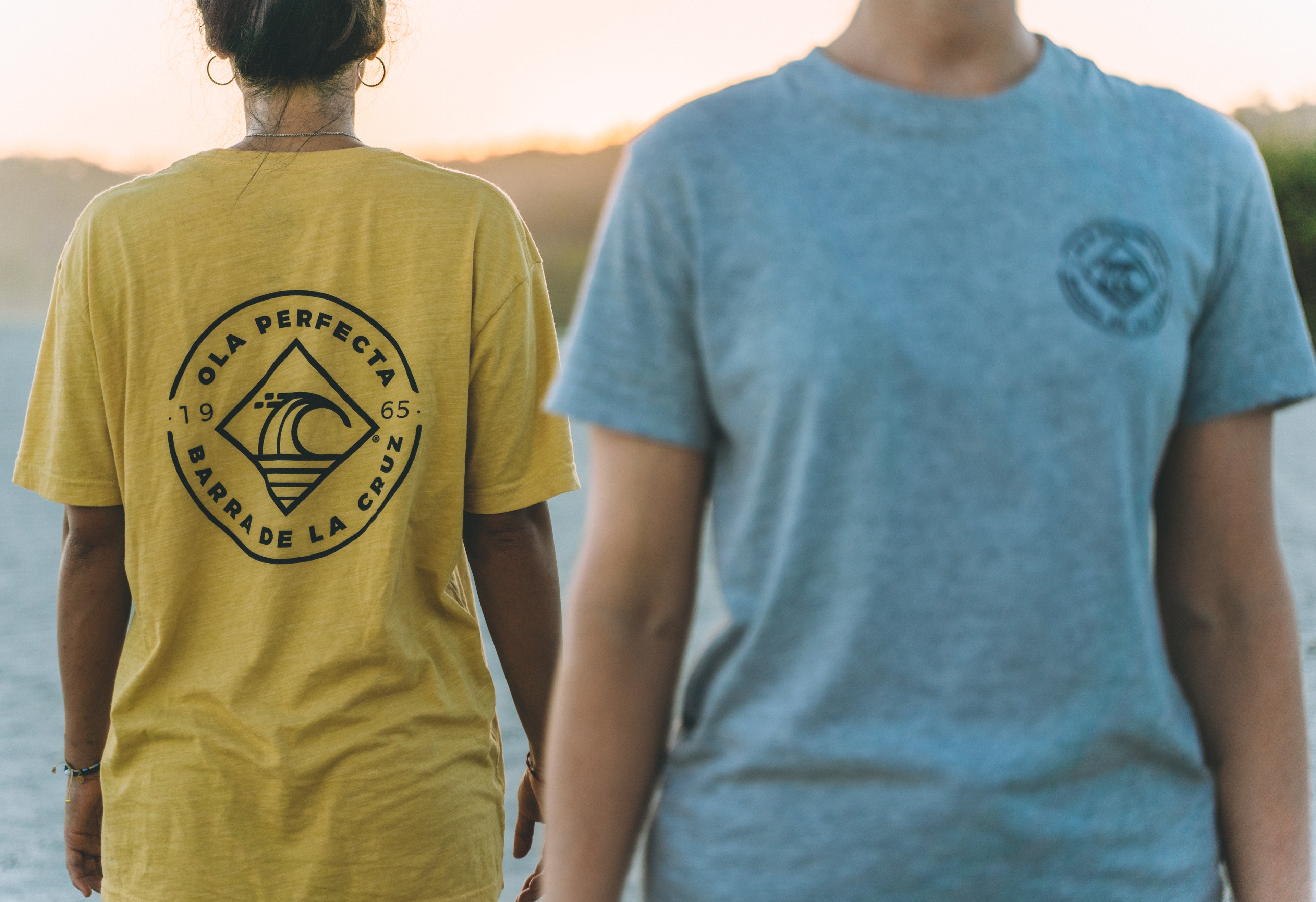 Surfer wearing OLA PERFECTA® apparel at Barra de la Cruz, Oaxaca.