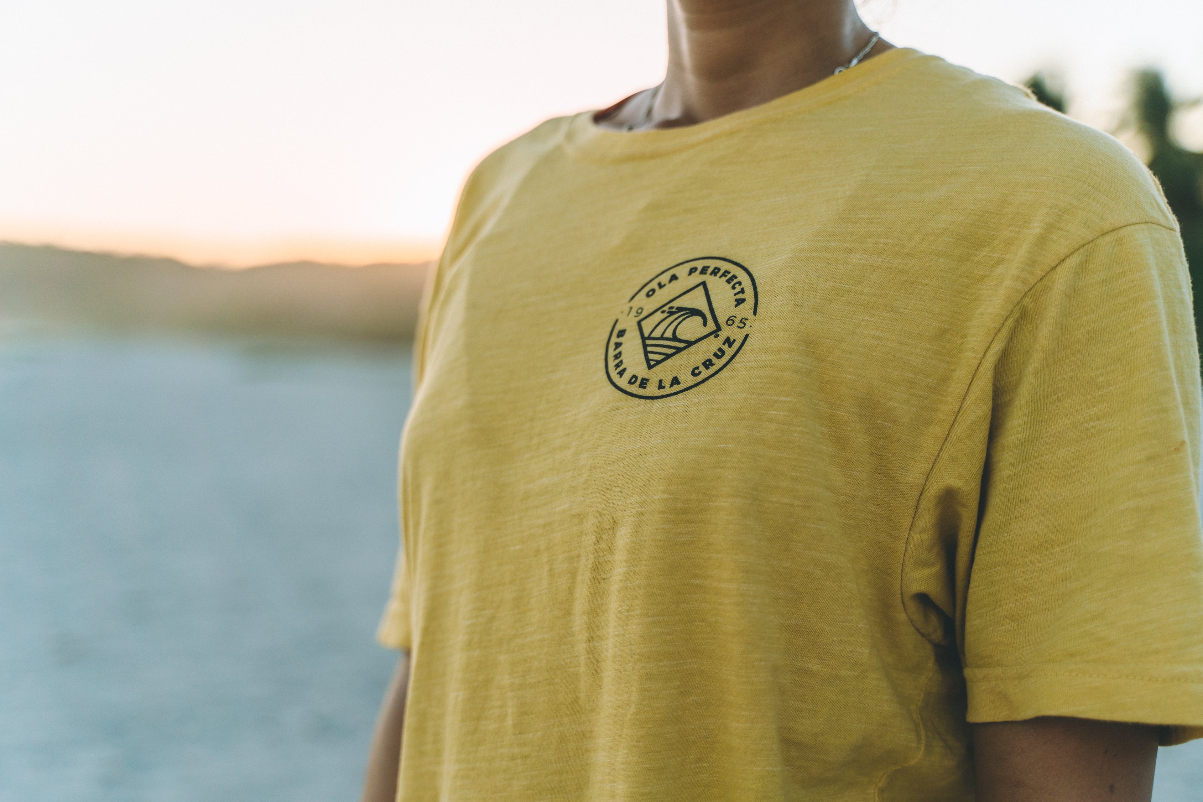 Yellow OLA PERFECTA® surf lifestyle t-shirt inspired by Barra de la Cruz.
